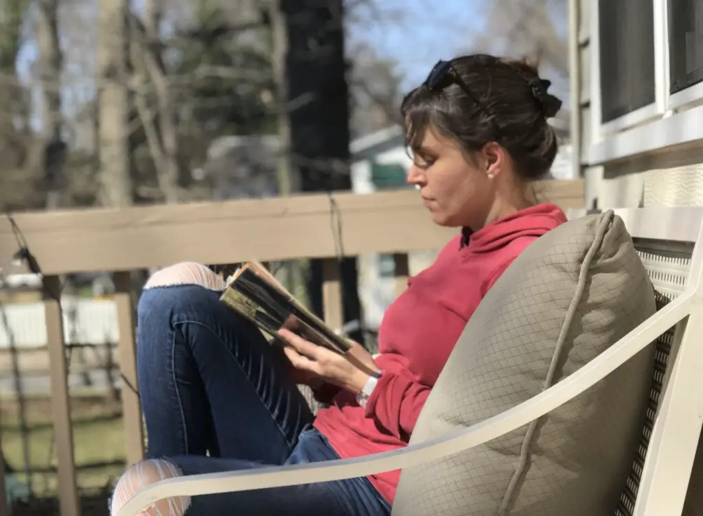 Kristen reading outside