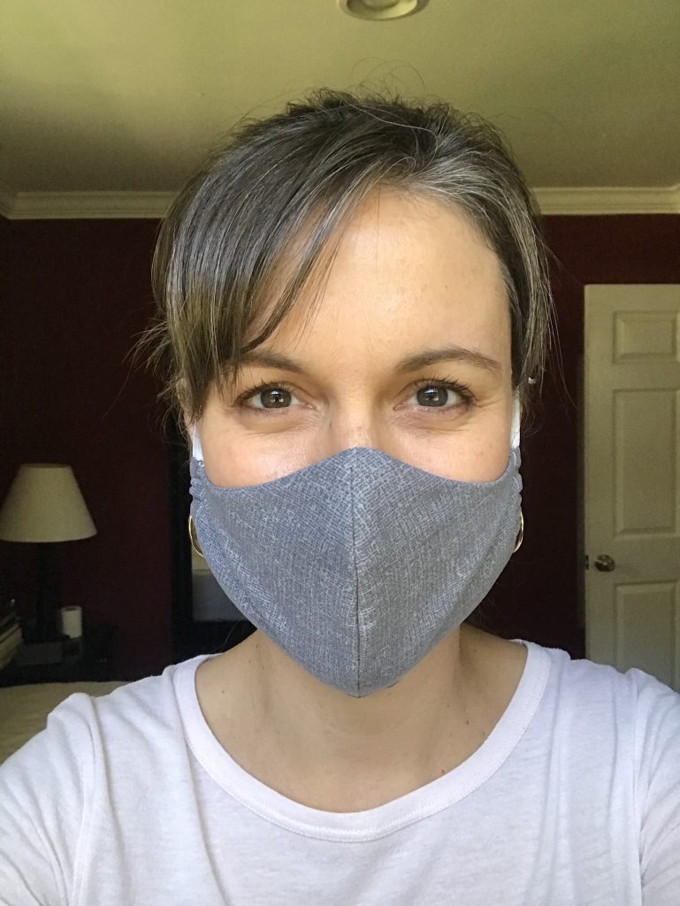 Kristen in a gray fabric mask