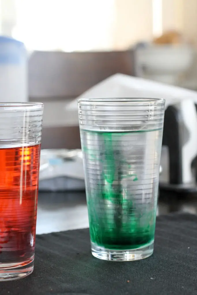 Green food coloring in a glass.