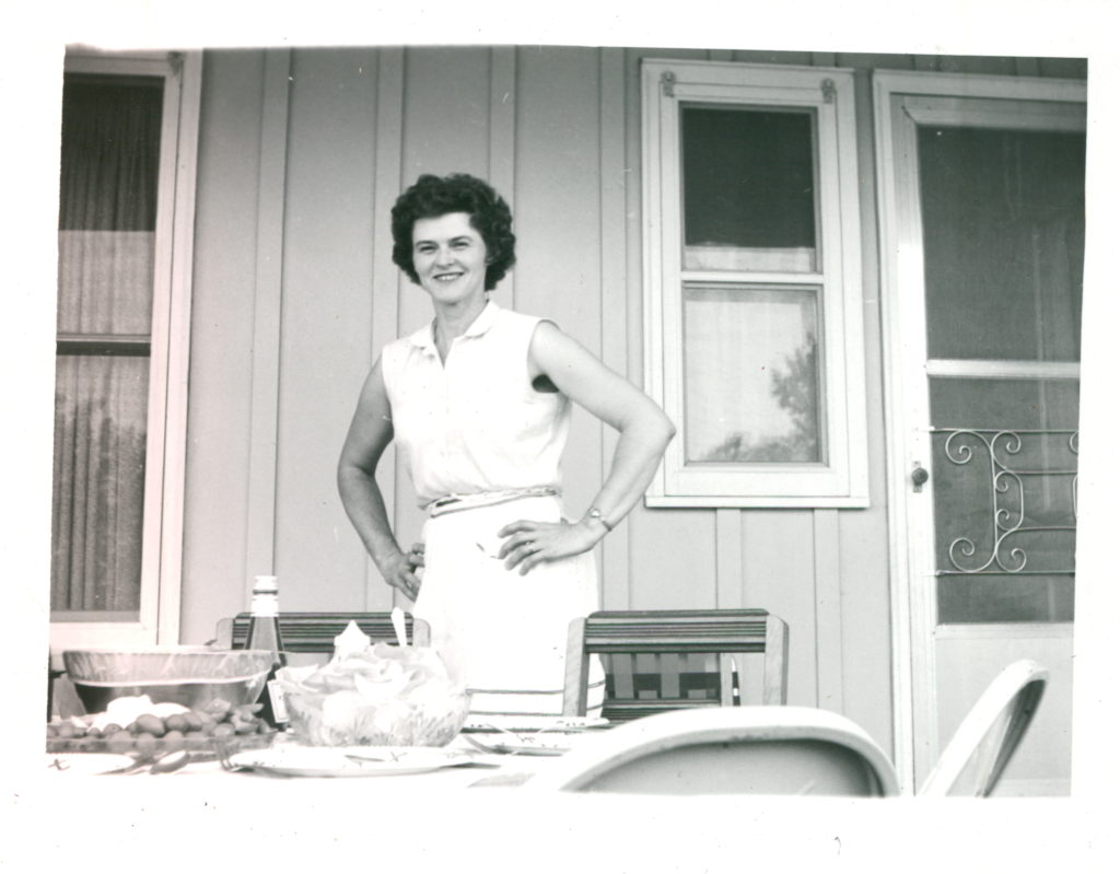 Kristen's grandma, standing with her hands on her hips.