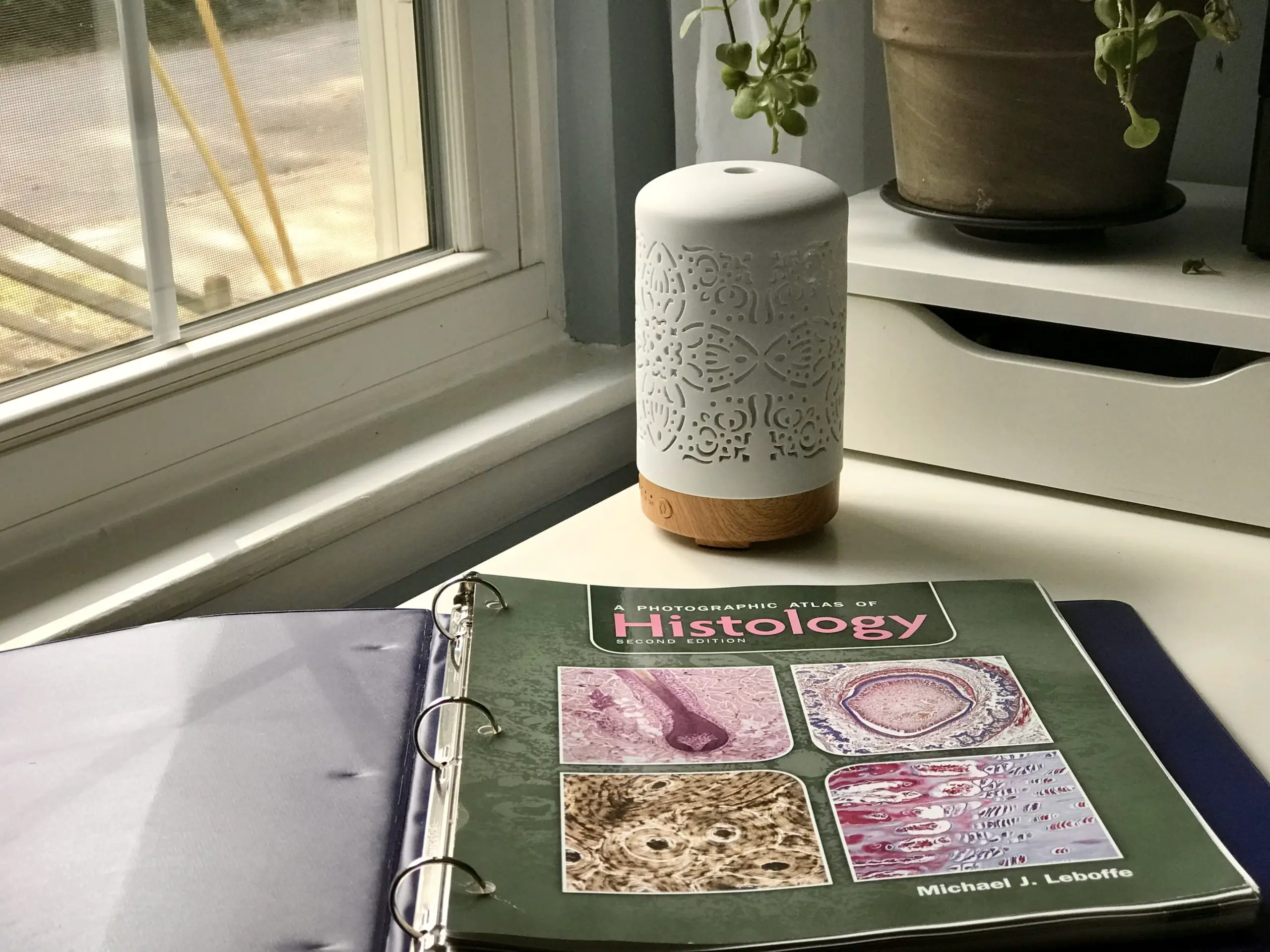 Histology book on a desk.