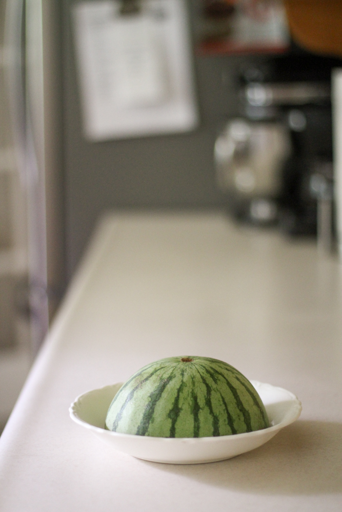 half a watermelon in a bowl.